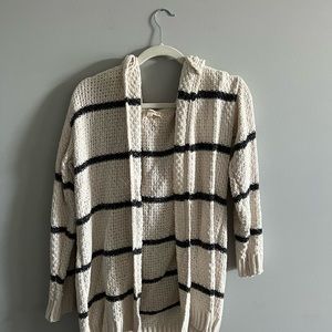 White and navy blue striped sweater.